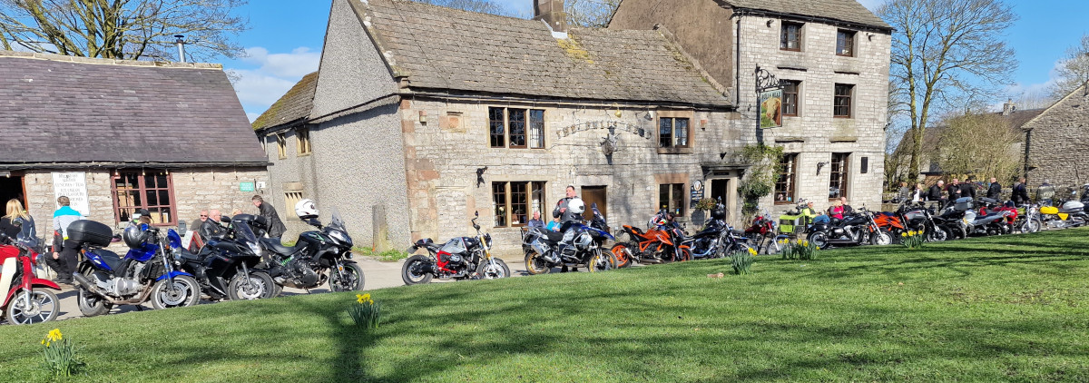 Row of motorbikes parked at Monyash